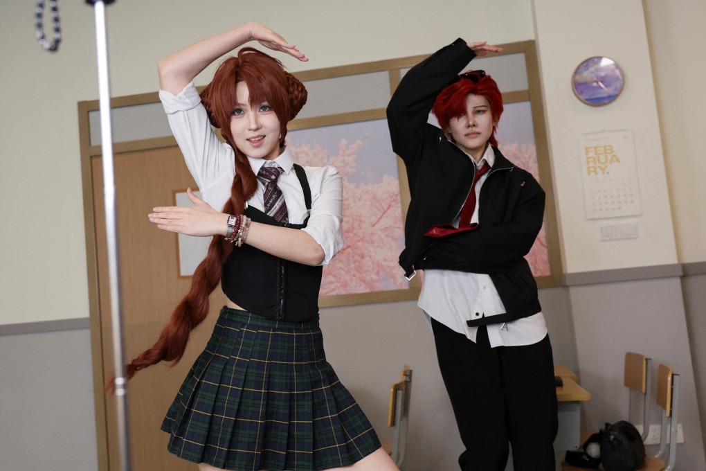 Visitors dance while wearing costumes at Chen Go, an “idol experience centre” where fans dress up as K-pop idols and step onto sets carefully designed to resemble backstage dressing rooms and South Korean music programmes, in Shanghai, China. Photo: Reuters