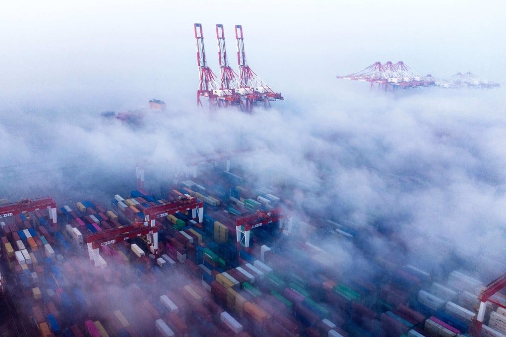 Ships and containers are seen shrouded in fog at a port in Shanghai. China is improving its export controls to mitigate the impact of a trade war with the United States. Photo: AFP