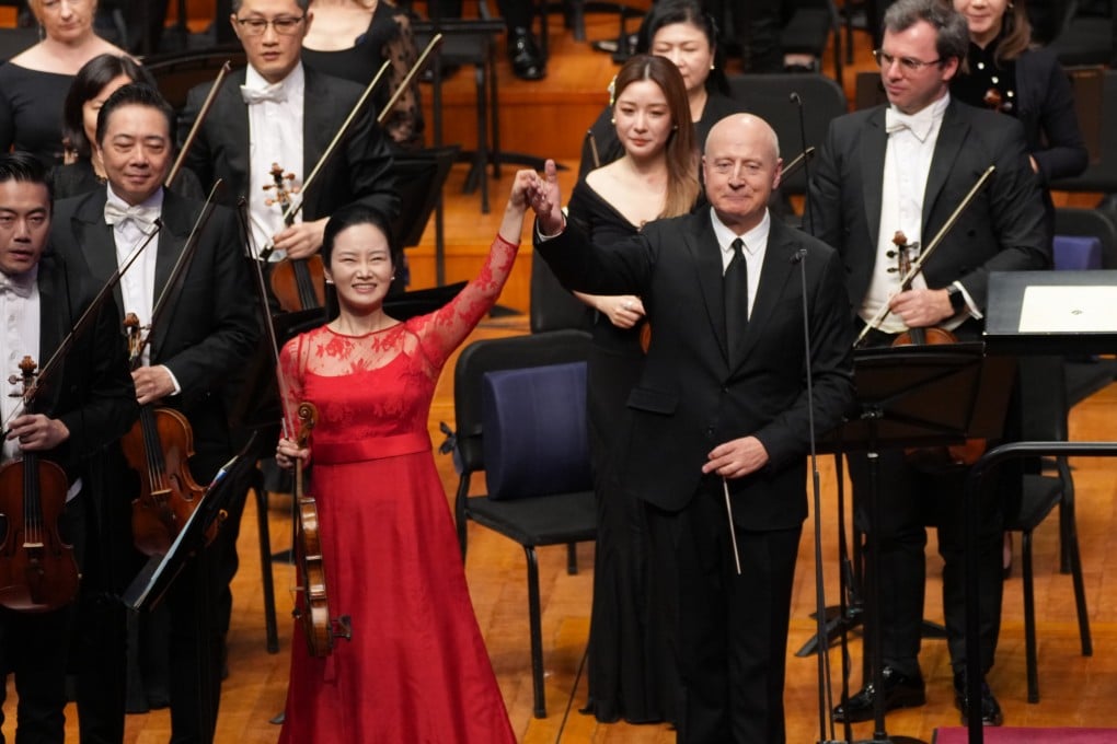 Violinist Bomsori Kim, conductor Paavo Järvi and the Hong Kong Philharmonic Orchestra receive the applause of the audience at the Concert Hall, National Centre for the Performing Arts in Beijing on April 7 for their performance of Prokofiev’s Violin Concerto No 2. Photo: Desmond Chan/HK Phil