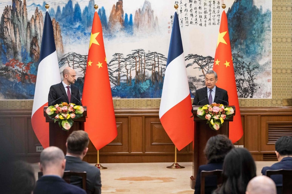 French Foreign Minister Jean-Noel Barrot (left) and his Chinese counterpart Wang Yi hold a joint press conference in Beijing on March 27. During his trip, Barrot pressed Chinese officials to do something about tariffs on cognac imports. Photo: AFP