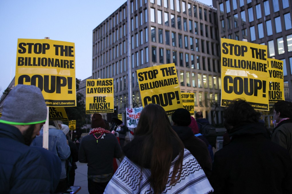Demonstrators gather outside of the Office of Personnel Management in Washington on Feburary 7 to protest against federal lay-offs and demand the termination of Elon Musk from the Department of Government Efficiency. Photo: AFP / Getty Images / TNS