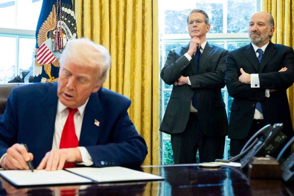 US President Donald Trump signs an executive order as Treasury Secretary Scott Bessent (second from right) and Commerce Secretary Howard Lutnick look on in the Oval Office of the White House on April 9. Photo: AFP