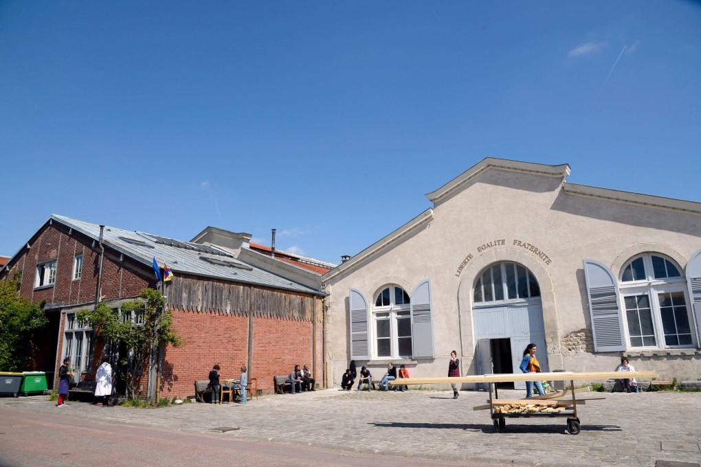 People stand outside “Le Theatre du Soleil” of the Cartoucherie theatre in the Bois de Vincennes, in Paris. The Theatre du Soleil has launched a wide-ranging internal investigation to shed light on an actress’ allegations of past “sexual misconduct” within the company. Photo: AFP