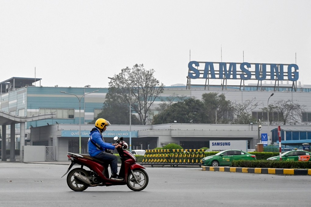 A man riding a motorbike through the entrance gate of Samsung’s electronic components factory in Bac Ninh province. Samsung has said previously it would respond flexibly to US tariffs. Photo: AFP