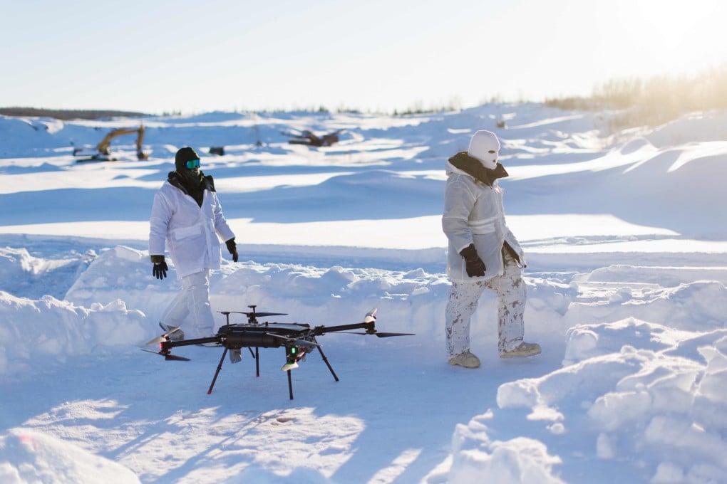 Canadian sailors walk by a drone as a team from the Canadian Navy test thermal imaging drone capabilities in Arctic environments, during Operation Nanook in Inuvik, Northwest Territories, Canada, on February 27. Photo: AFP