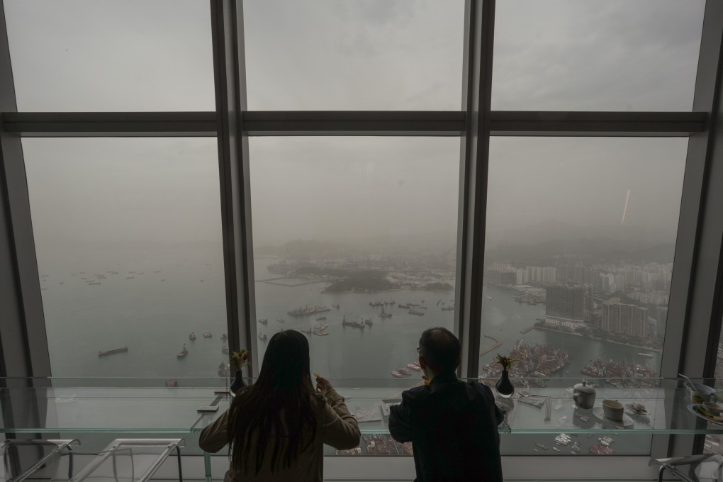 An obscured Victoria Harbour seen from Sky100 in West Kowloon. The Environmental Protection Department noted the airborne dust primarily consisted of PM10, or larger respirable suspended particulates. Photo: Sun Yeung