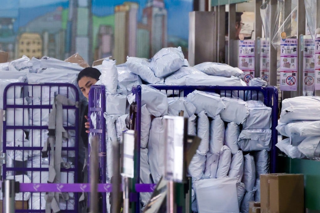 Parcels being sorted at the General Post Office in Central. US President Donald Trump has further raised tariffs on small parcels sent to the United States from mainland China and Hong Kong to 120 per cent. Photo: Nora Tam