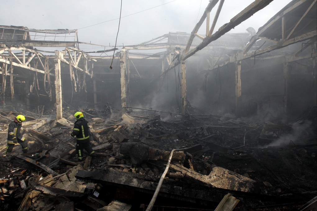 Firefighters put out a blaze at a warehouse damaged by the April 10 Russian missile strike in Dnipro, Ukraine. Photo: dpa