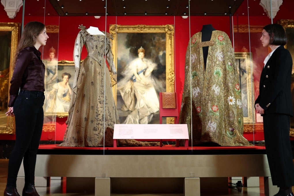 A glass case contains Queen Alexandra’s coronation dress and King Edward VII’s coronation mantle at “The Edwardians: Age of Elegance” exhibition in Buckingham Palace, London. Photo: AFP