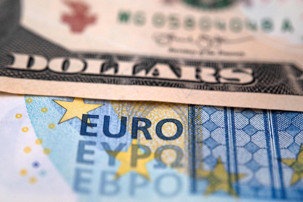 US dollar and euro notes are pictured on September 6, 2022 in Brest, western France. Photo: AFP