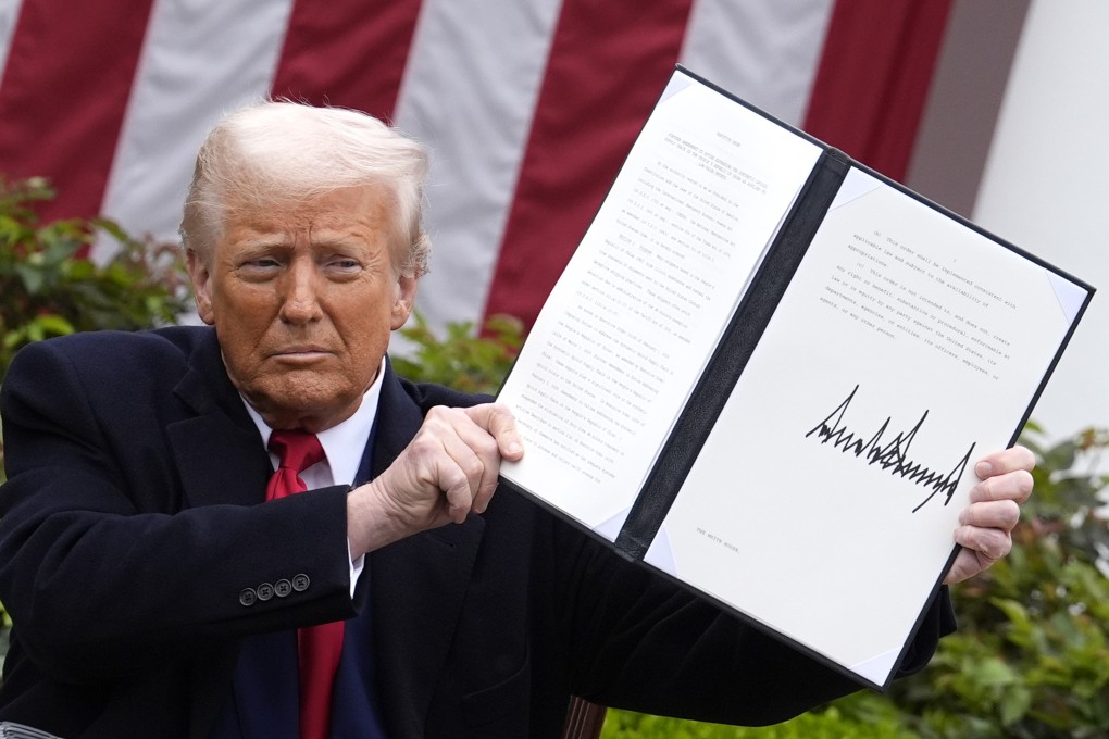US President Donald Trump holds an executive order on tariffs at the White House on April 2. Photo: Abaca Press/TNS