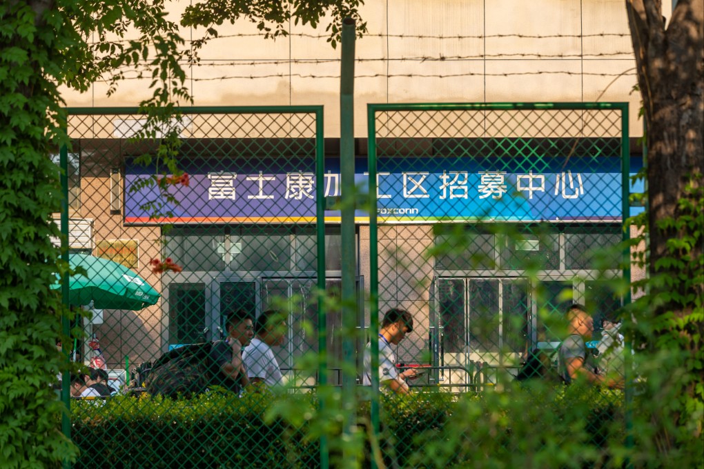 Jobseekers are seen outside the recruitment office of a Foxconn production base in Zhengzhou in central China’s Henan province. Photo: Feature China/Future Publishing via Getty Images