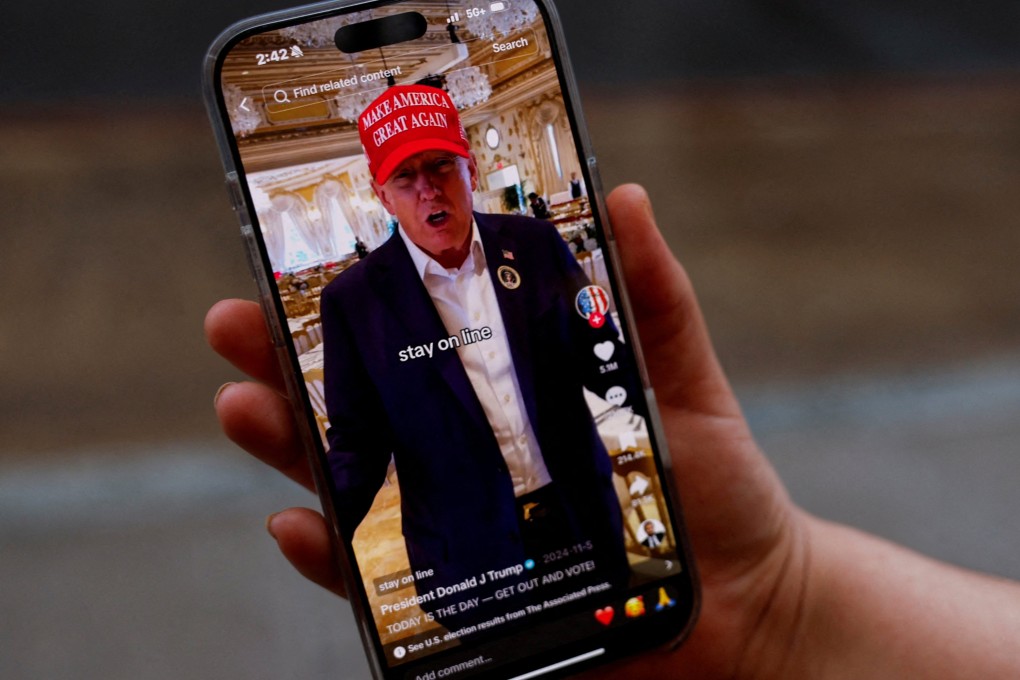 A woman poses with her smartphone displaying the @realdonaldtrump TikTok page, in Washington, US, on January 19. Photo: Reuters
