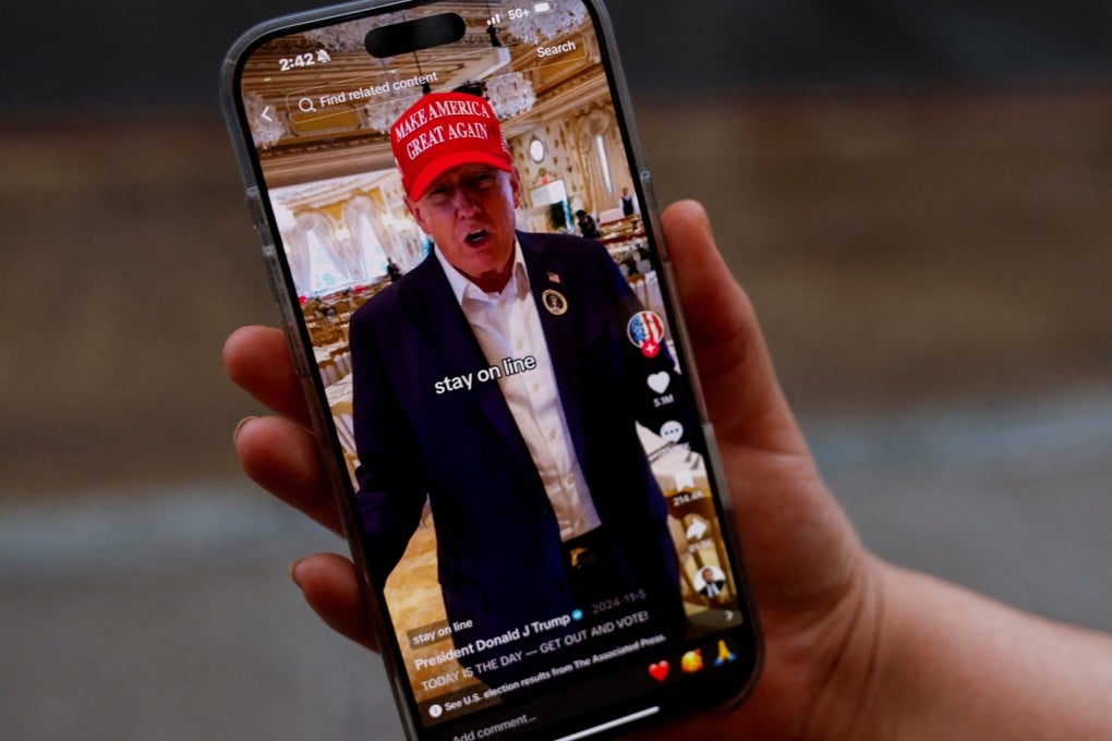 A woman poses with her smartphone displaying the @realdonaldtrump TikTok page, in Washington, US, on January 19. Photo: Reuters