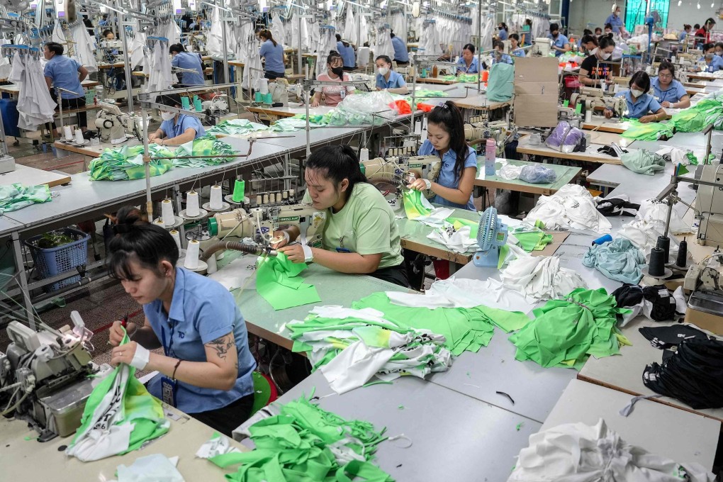 Vietnamese garment factory workers stitch apparel at a factory in Ho Chi Minh City on April 3. Photo: AFP