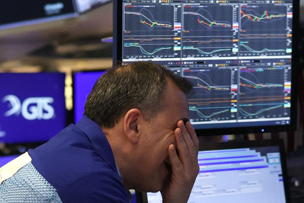 A trader facepalms on the floor of the New York Stock Exchange in New York, on April 4. Photo: AFP