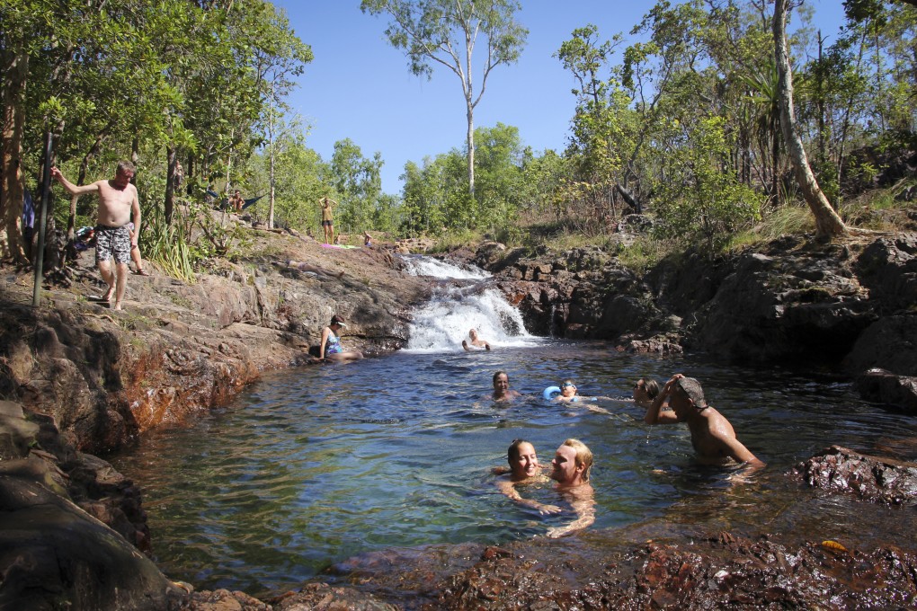 People swim at a waterfall in Litchfield National Park, one of Top End tourism expert Jay Bichard’s recommendations for visitors to the Australian region. Photo: Alkira Reinfrank