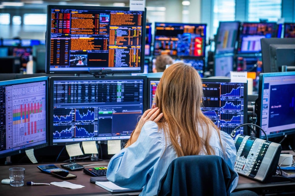 Employees in the trading room of Nordea Markets follow the turmoil and sharp stock market declines following the tariff war that is affecting markets worldwide in Oslo, Norway, on April 7. Photo: AFP