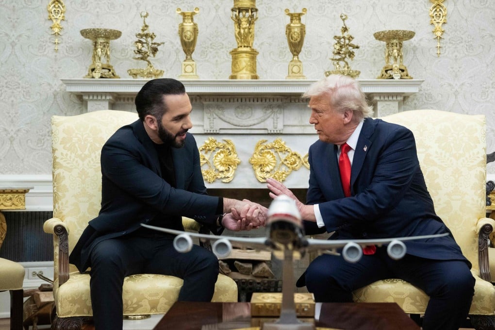 US President Donald Trump shakes hands with El Salvador’s President Nayib Bukele in the White House on Monday. Photo: AFP
