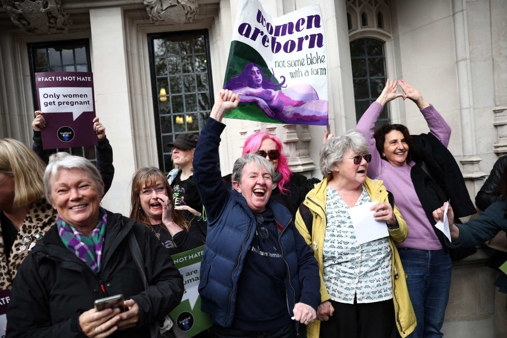 Activists celebrate after hearing the outcome of the Supreme Court’s ruling on how to define a “woman”, in London on Wednesday. Photo: AFP