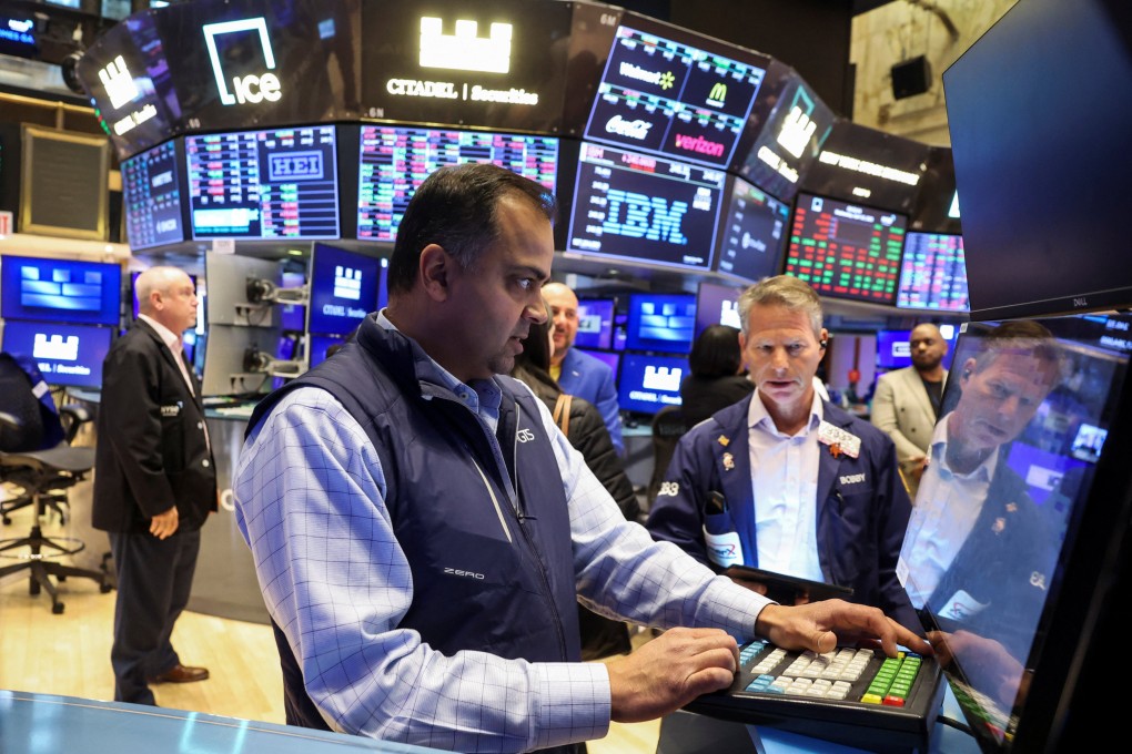Traders work on the floor at the New York Stock Exchange on Wednesday.  Photo: Reuters