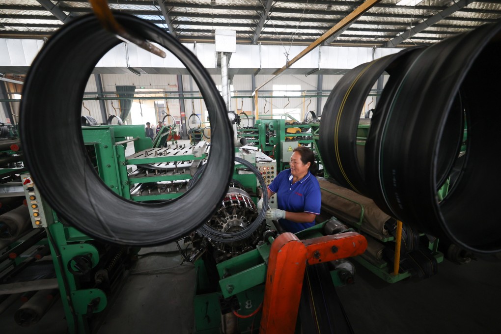A worker inside a tyre manufacturing line in Lianyungang, Jiangsu province in October 2023. Photo: Getty Images