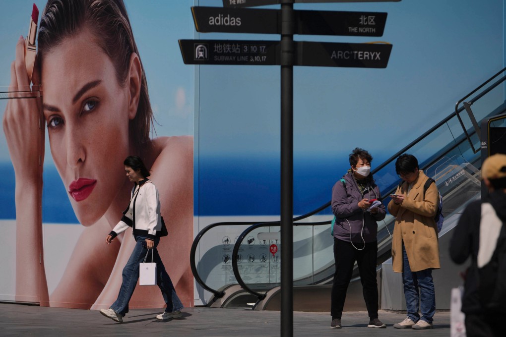 Shoppers visit in a mall in Beijing. Photo: AP