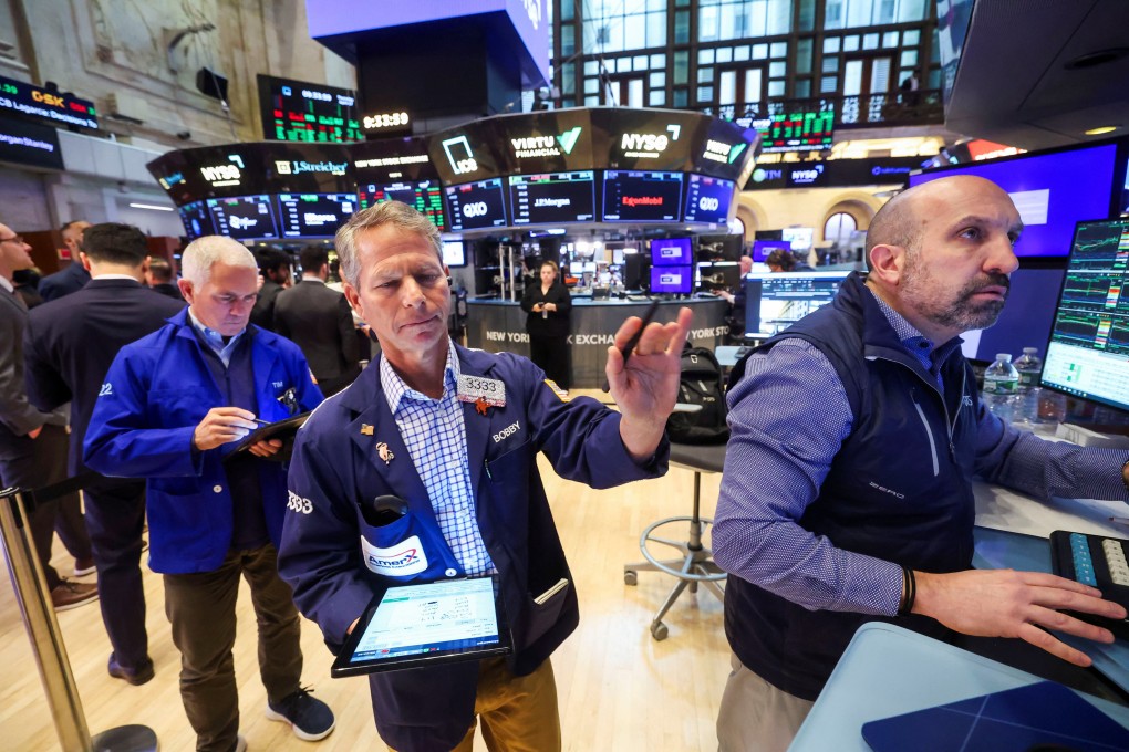Traders work at the New York Stock Exchange on Thursday. Photo: Reuters