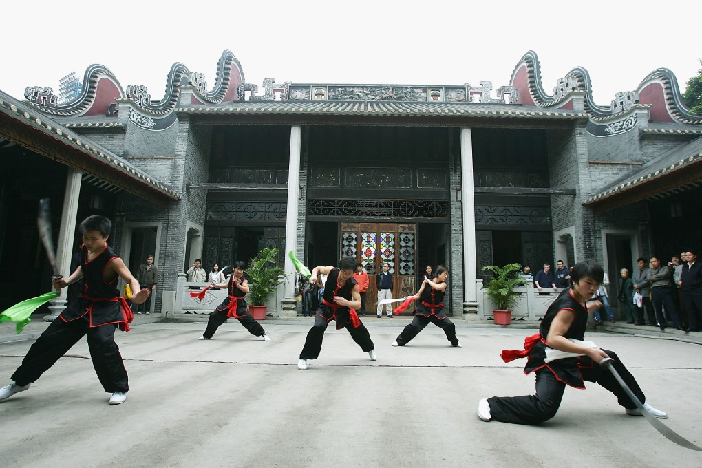 Members of the Wong Fei-hung martial
arts team perform at the Wong Fei-hung Memorial Hall in Foshan. Photo: Getty Images