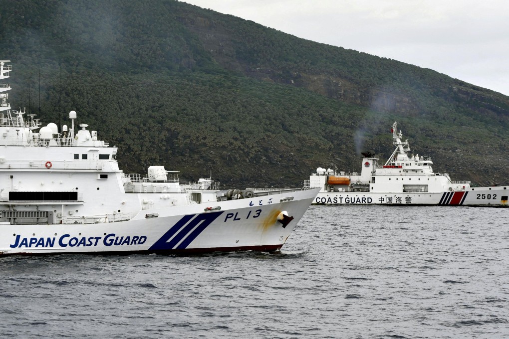 A Chinese coastguard vessel sails near a Japanese coastguard vessel off Uotsuri Island, one of a group of disputed islands called the Senkakus in Japan, also known in China as the Diaoyus, in the East China Sea in April 2024. Photo: Kyodo via Reuters