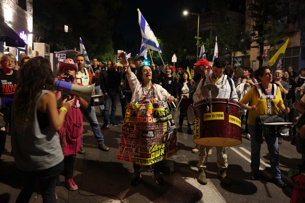 Relatives and supporters of Israeli hostages held captive in Gaza call for action to secure the hostages’ release, outside Israeli Prime Minister Benjamin Netanyahu’s home in Jerusalem, Israel on Thursday. Photo: AFP