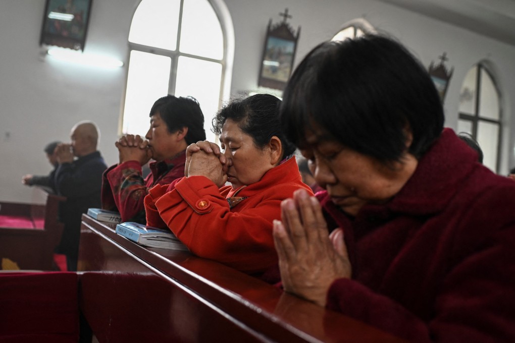 Chinese Catholics pray at Easter Mass in a church near Beijing. Photo: AFP