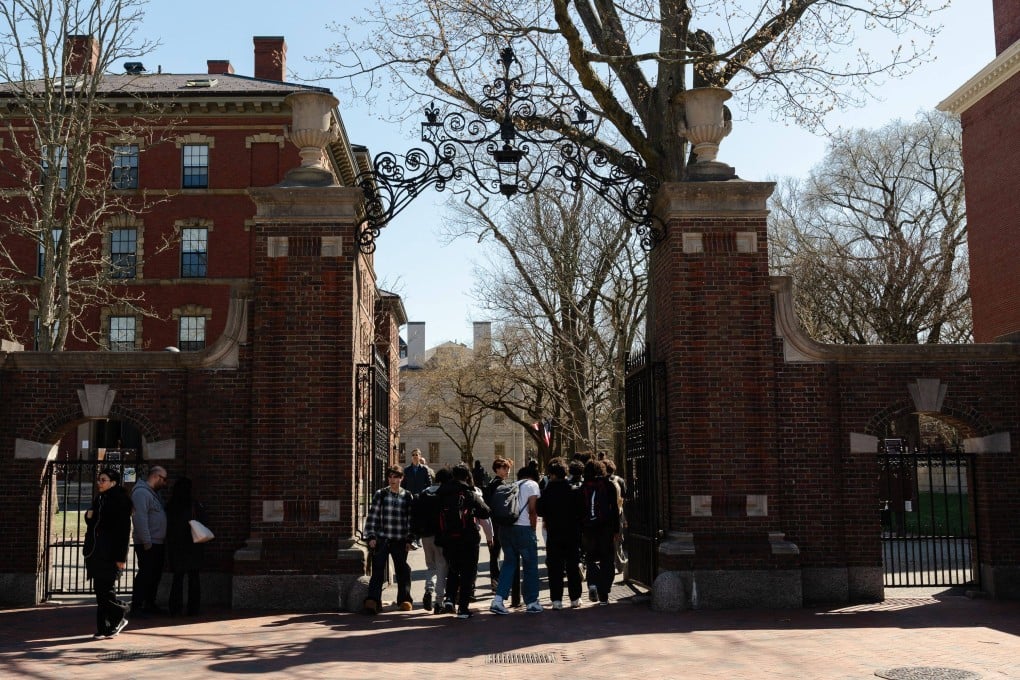 Students gather at one of the gates of Harvard University in Cambridge, Massachusetts. Photo: Getty Images