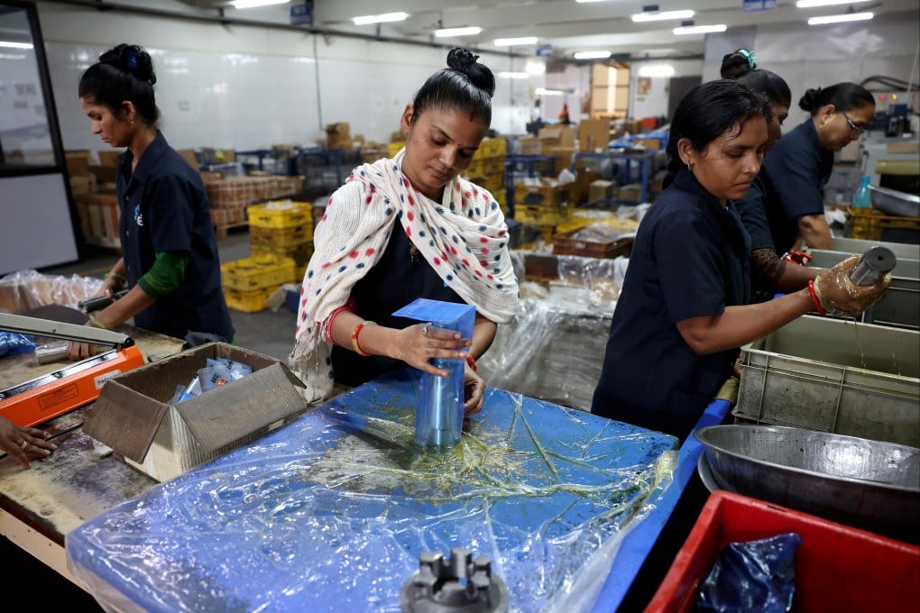 Employees pack parts for commercial vehicles inside an auto component manufacturing facility in Rajkot, India, on April 3. Photo: Reuters