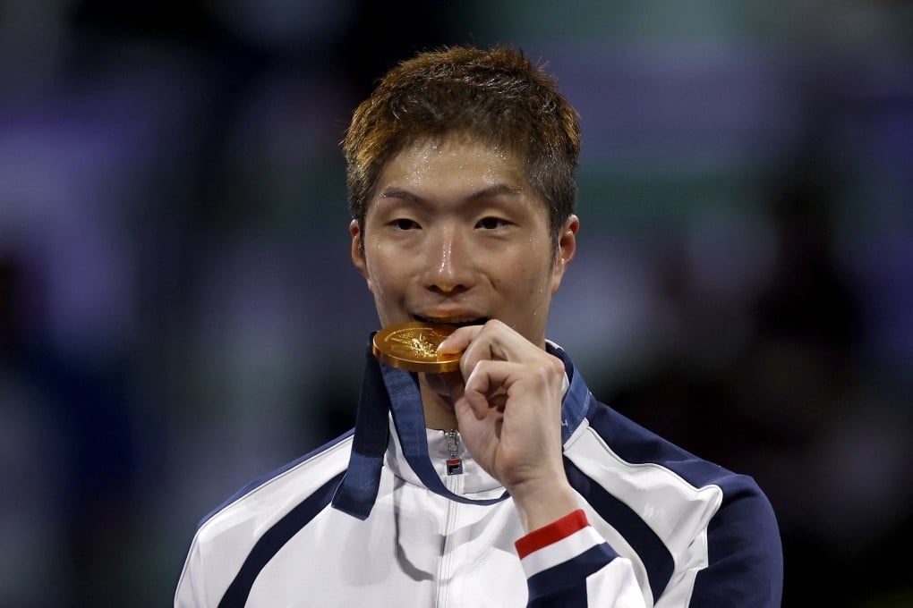 Cheung Ka-long collects his second Olympic gold, in Paris last July. Photo: Reuters