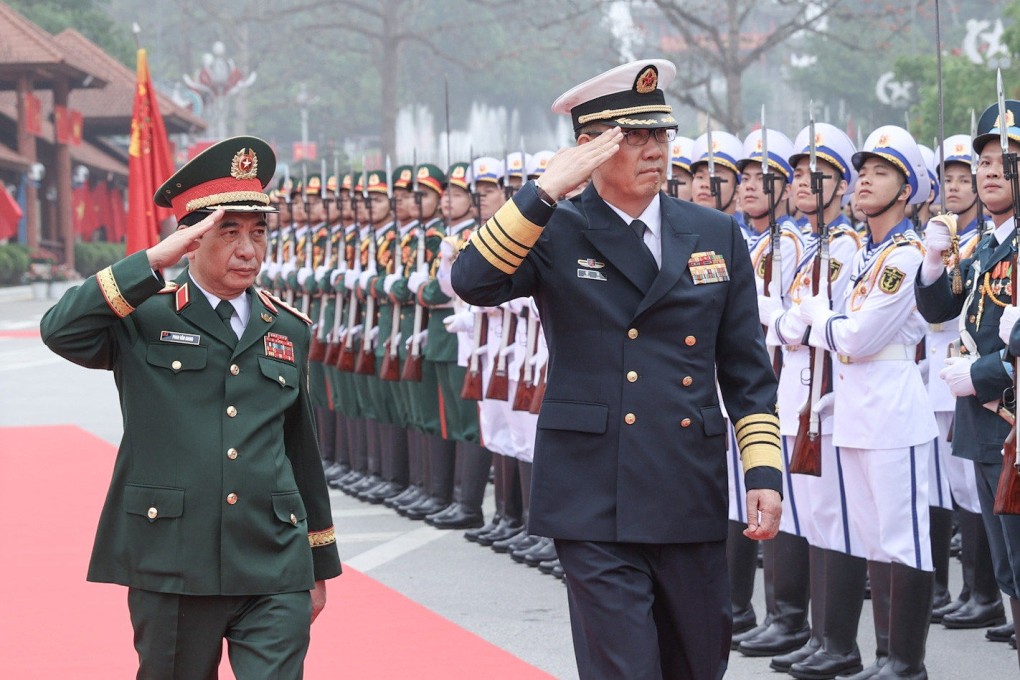 Chinese Defence Minister Dong Jun (right) and Vietnam’s Phan Van Giang inspect a guard of honour at the Huu Nghi international border gate in Lang Son province on Thursday. Photo: Handout