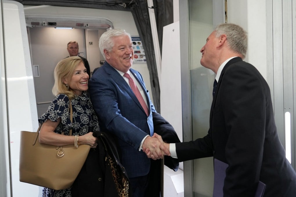 US envoy George Glass and his wife Mary are welcomed by Joseph Young, acting deputy chief of mission at the US embassy in Tokyo, upon their arrival at Haneda airport on Friday. Photo: Reuters