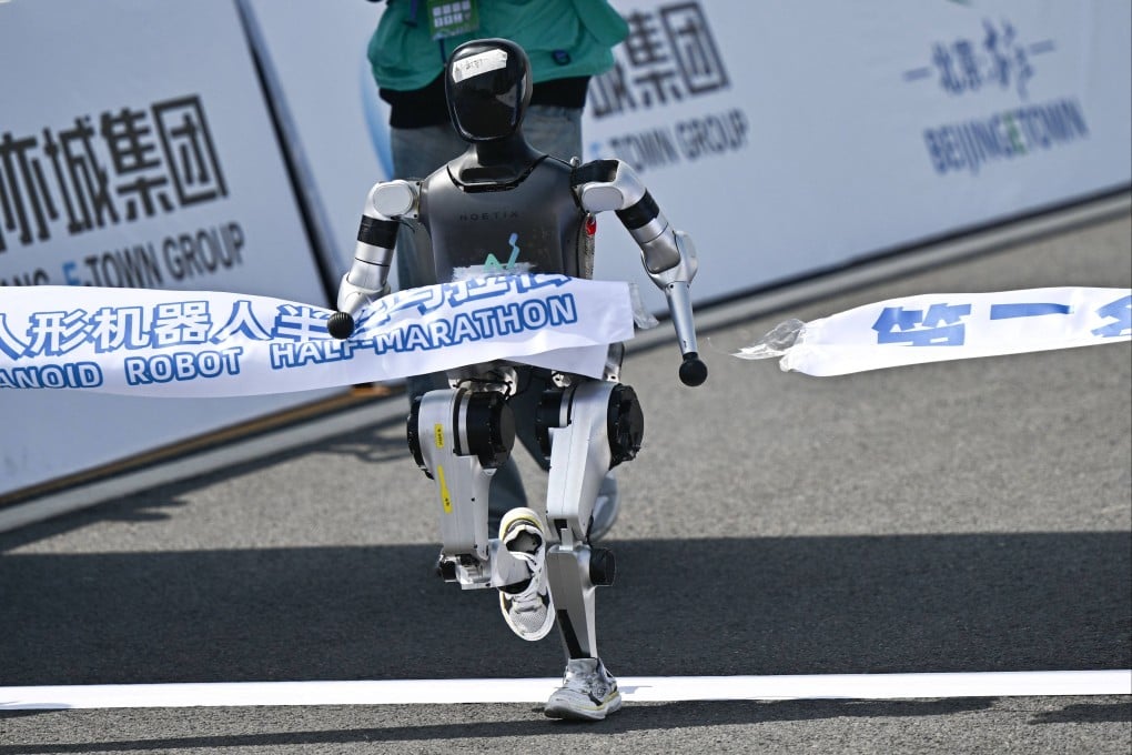 A robot crosses the finish line in the half-marathon in Beijing on Saturday. Photo: AFP
