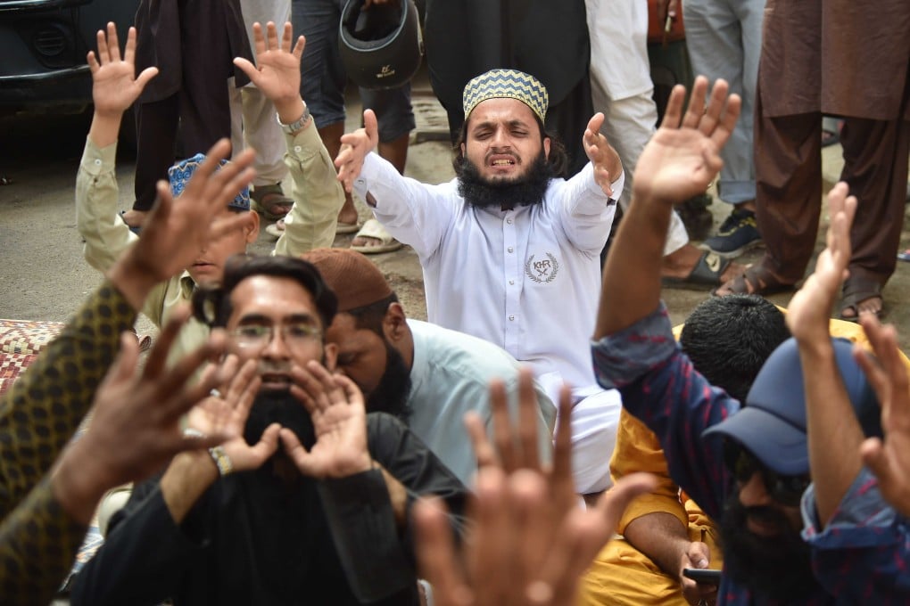 Supporters of Tehreek-e-Labbaik Pakistan (TLP) shout slogans during a demonstration against Pakistan’s minority Ahmadi community in Karachi, Pakistan, on Friday. Photo: EPA-EFE
