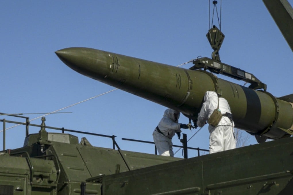 Russian troops load an Iskander missile onto a mobile launcher during drills at an undisclosed location in Russia. Photo: Russian Defense Ministry Press Service via AP