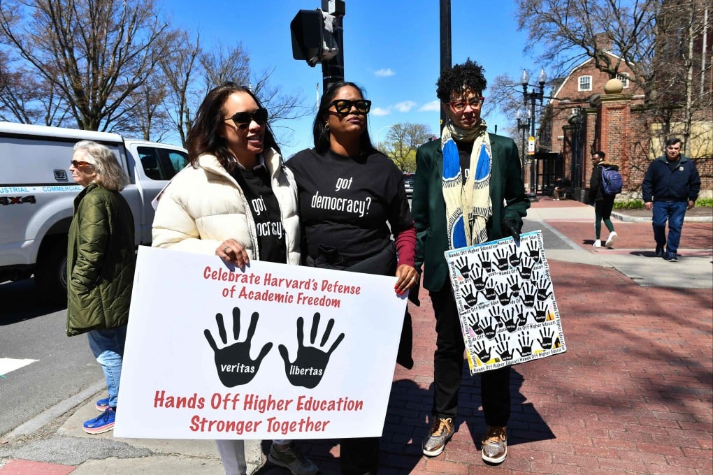 Demonstrators hold a “Hands off higher education” sign at Harvard University in Cambridge, Massachusetts, on Thursday. Photo: AFP