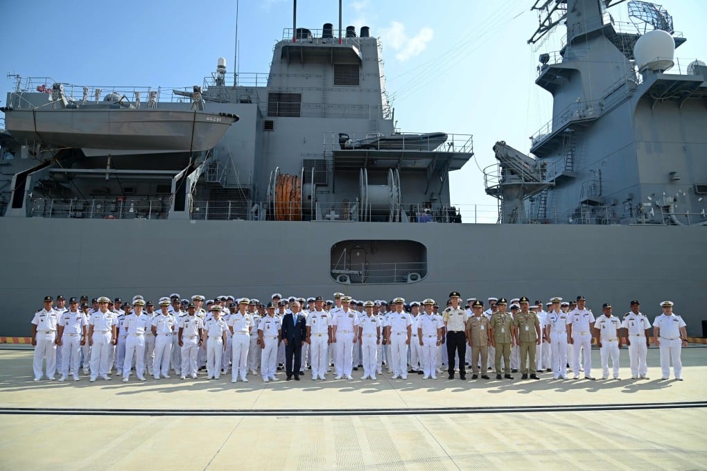 Japan Maritime Self-Defense Force (JMSDF) and Royal Cambodian Navy personnel posing for a group photo following the arrival of the JMSDF mine countermeasures vessel JS Bungo and the Awaji-class minesweeper JS Etajima at the Ream Naval Base, located off Cambodia’s southern coast in Preah Sihanouk province, on Saturday. Photo: AFP
