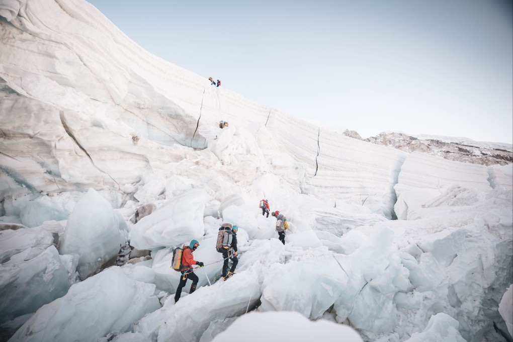 Climbers on a glacier at a base camp, 5,364 m (17,598 ft) above sea level, of Mt. Everest in Nepal, April 26 2024. Nepalese climber Kami Rita Sherpa broke his own record on 12 May that year after successfully climbing Mt Everest for the 29th time. Photo: EPA-EFE