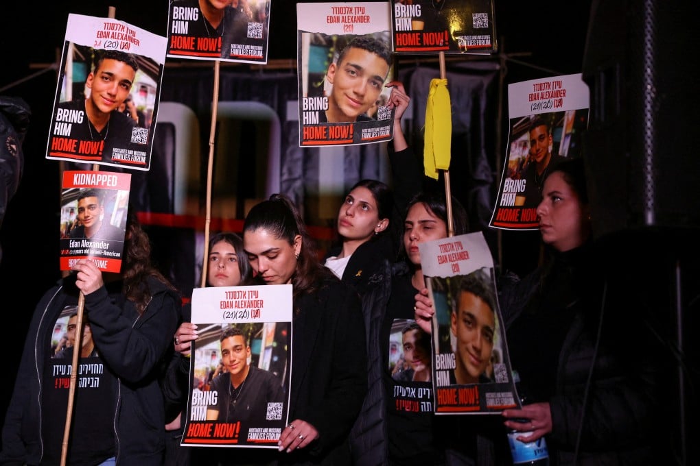 People carry posters with pictures of Edan Alexander during a protest demanding the release of all Israeli hostages in Jerusalem on April 13. Photo: Reuters