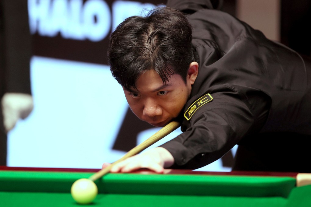 Lei Peifan lines up a shot during his match against Kyren Wilson at the World Snooker Championship. Photo: AP