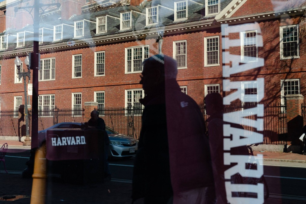 Harvard University is reflected in the window of a merchandise store across the street from the school in Cambridge, Massachusetts. Photo: Getty Images North America