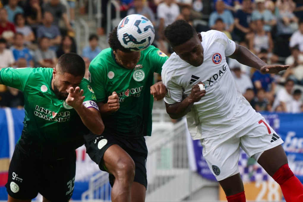Noah Baffoe (right) beats Weverton Rangel (centre) and Gabriel Cividini to the ball. Photo: Jonathan Wong