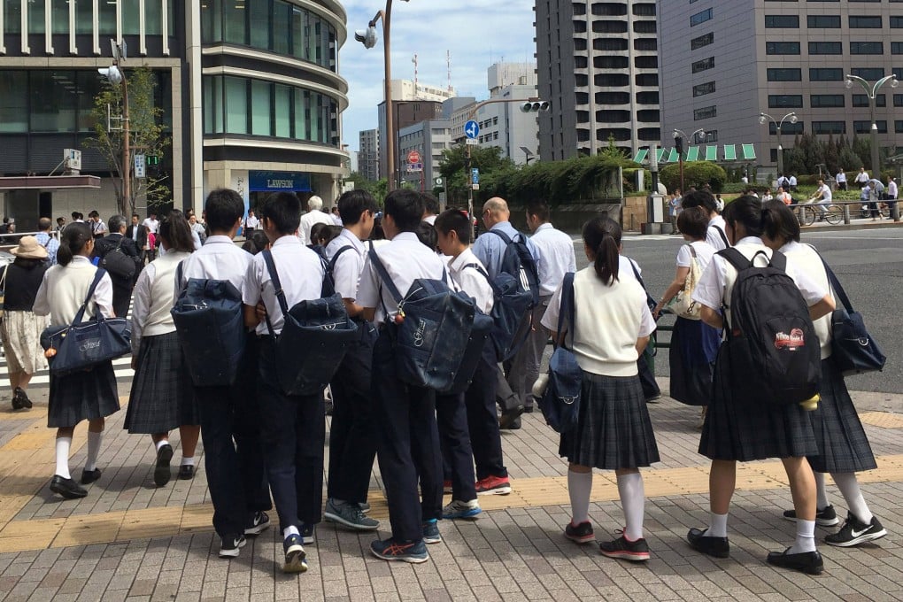 Japanese schoolchildren crossing a street in Tokyo. Photo: AFP