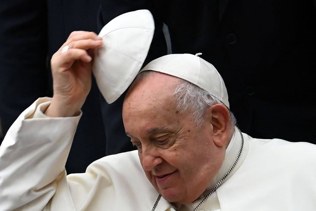 Pope Francis swaps his skull cap during the weekly general audience at the Vatican in January 2024. The death of the pontiff triggers several rituals, including mourning, a funeral, and a conclave. Photo: AFP