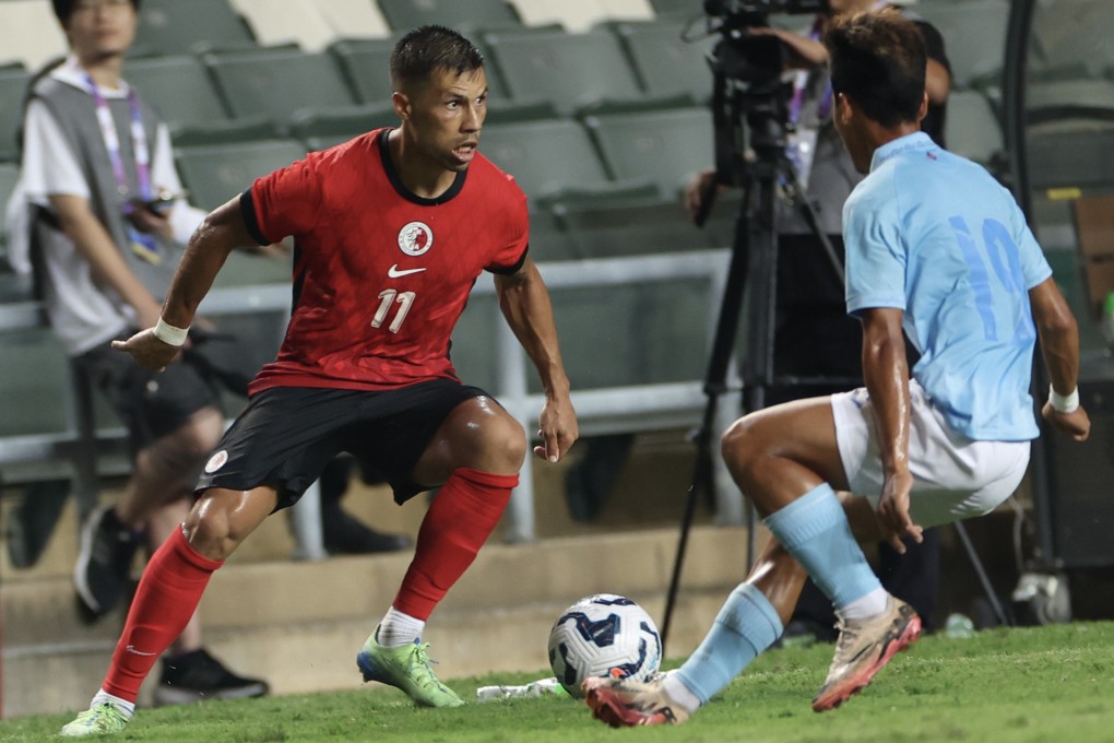 Juninho (left) eyes an attacking opportunity during Hong Kong’s 3-0 victory over Cambodia last October. Photo: Dickson Lee